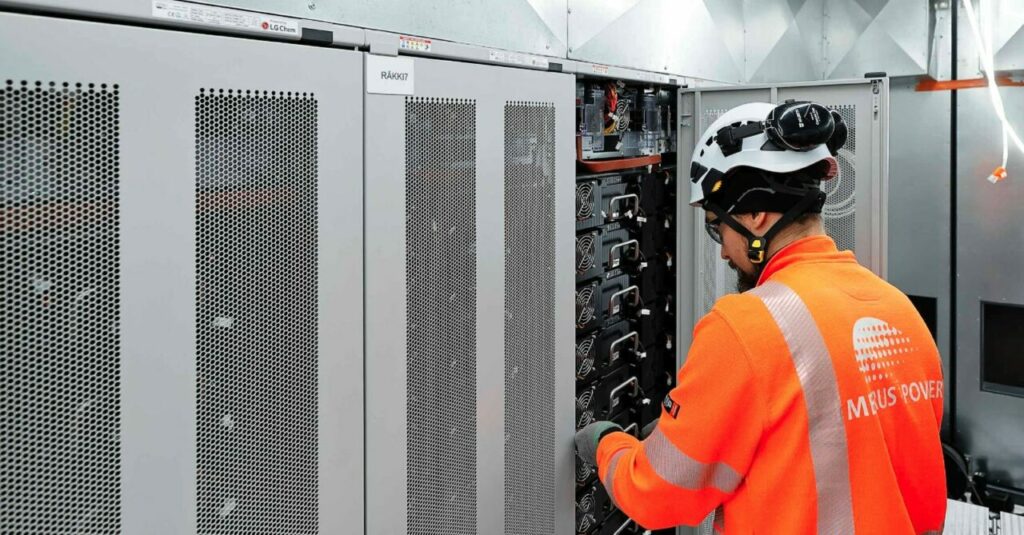 A battery energy storage comprising LG Chem units being worked on by a Merus Power worker. The company is headquartered in Finland. 