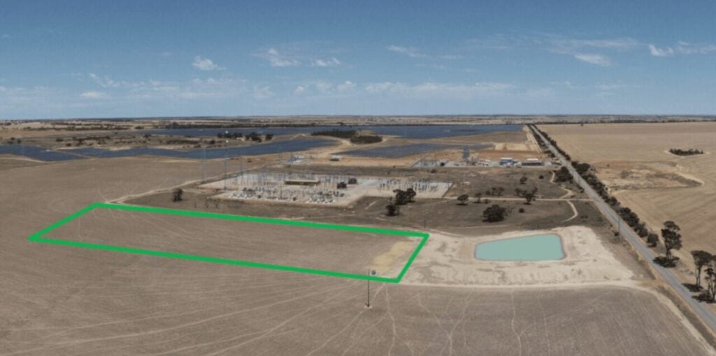Aerial photograph of the plot of land in the Western Australia wheatbelt where the Merredin BESS will be sited, with the proposed location of the BESS marked out with a green rectangle next to substation infrastructure.