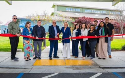 Peninsula Clean Energy CEO Shawn Marshall cuts the ribbon to inaugurate a solar PV carport project in Los Banos, California, with the city's mayor Michael Amabile earlier this year. Image: Peninsula Clean Energy