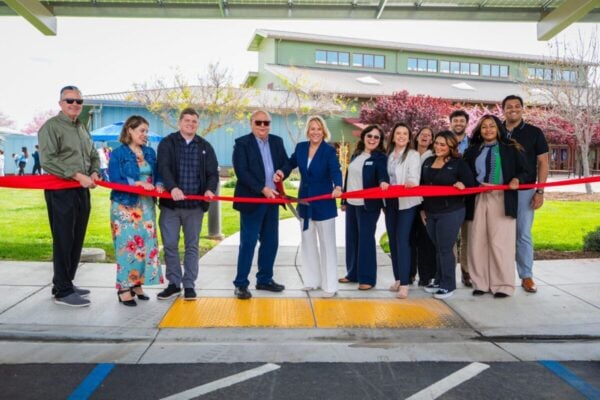 Peninsula Clean Energy CEO Shawn Marshall cuts the ribbon to inaugurate a solar PV carport project in Los Banos, California, with the city's mayor Michael Amabile earlier this year. Image: Peninsula Clean Energy