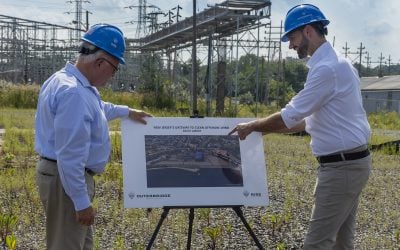 South Amboy's Mayor Fred Henry (left) with Rise Light & Power CEO Clint Plummer take a look at the plans. Image: Rise Power & Light.