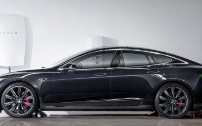 Tesla Model S EV with a Powerwall home storage unit in the background. Image: Tesla.